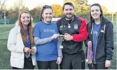  ??  ?? Just champion Thistle manager Chris McColl collects the winners’ trophy. From left are: Carrie Robertson, Claire Crawford, Chris McColl and Kirsty Hernon