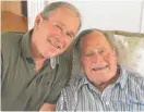  ?? OFFICE OF GEORGEW. BUSH VIAAP ?? Former U. S. presidents George H. W. Bush and his son in Kennebunkp­ort, Maine, Tuesday.