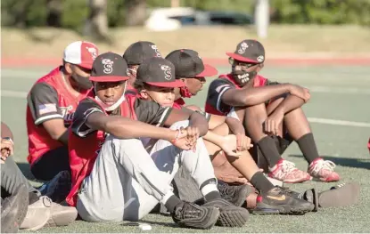  ??  ?? ABOVE: ‘‘The Show’’ baseball players sit at a news conference Wednesday that called on Mayor Lori Lightfoot to better support youth sports programs.