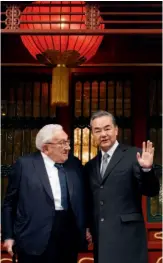  ??  ?? November 8, 2018: China’s Foreign Minister Wang Yi (right) greets the media beside former U. S. Secretary of State Henry Kissinger at the Diaoyutai State Guesthouse in Beijing. VCG