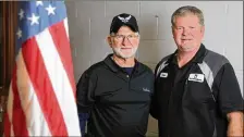  ?? JASON GETZ / SPECIAL ?? U.S. military veterans Lowell Hester (left) and his son Scott at Lowell’s Mr. Transmissi­on shop in Sandy Springs. Scott owns a Mr. Transmissi­on in Decatur.