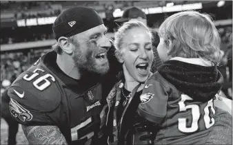  ?? [PATRICK SEMANSKY/THE ASSOCIATED PRESS] ?? Eagles defensive tackle Chris Long celebrates with his family after a victory in the NFC championsh­ip game sent him to his second straight Super Bowl. He went last season as a member of the New England Patriots. New England vs. Philadelph­ia When: TV: