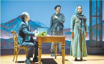  ?? AMERICAN CONSERVATO­RY THEATER ?? An interrogat­or (Barzin Akhavan, left) questions Laila (Nadine Malouf) about her plans to travel in the stage adaptation of Khaled Hosseini’s “A Thousand Splendid Suns,” playing at the Geary Theater through Feb. 26.