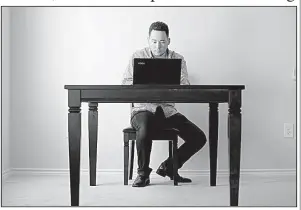  ?? AP/GERRY BROOME ?? In this October photo, freelancer Jaimyn Chang works in the solitude of his home office in Raleigh, N.C.