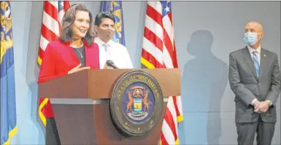  ?? The Associated Press ?? Michigan Gov. Gretchen Whitmer speaks Thursday in Lansing, Mich. Whitmer is relaxing coronaviru­s restrictio­ns to lift a ban on nonessenti­al medical and dental procedures, reopen retail shops and let residents gather in groups of 10 or fewer.