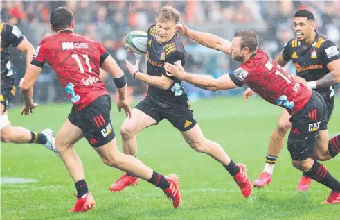  ?? Photo / Photosport ?? Southland born and raised Damian Mckenzie (centre) made his representa­tive debut for Waikato.