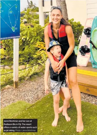  ?? Photo / Jenni Mortimer ?? Jenni Mortimer and her son at Radisson Blu in Fiji. The resort offers a variety of water sports such as jet skiing.