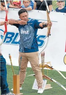  ?? Photo: GETTY IMAGES ?? Question marks: Keven Mealamu takes aim at an archery competitio­n during yesterday’s Super Rugby launch. The All Blacks hooker will miss the Blues’ first three matches this year.