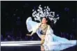  ?? FRED DUFOURT/AFP AFP ?? Model Ming Xi falls as she presents a creation during the Victoria’s Secret Fashion Show in Shanghai on Monday.