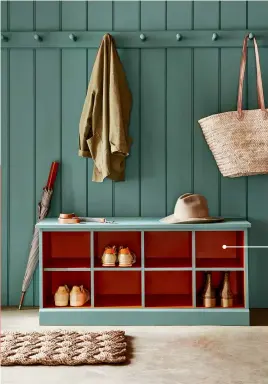  ??  ?? PLAY WITH DEPTH
Painting the panelling, peg rail and storage bench in the same hue creates an organized, cohesive look in an entryway. Take it to the next level by adding a vibrant, contrastin­g colour to the bench interior.