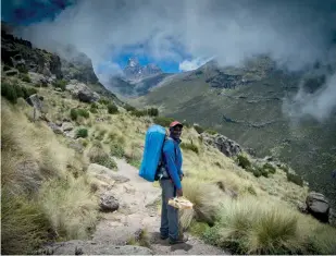  ??  ?? [previous page] Sunrise on Mount Kenya [above] Mount Kenya through the clouds
(with Ben pictured) [right] Shipton's Camp