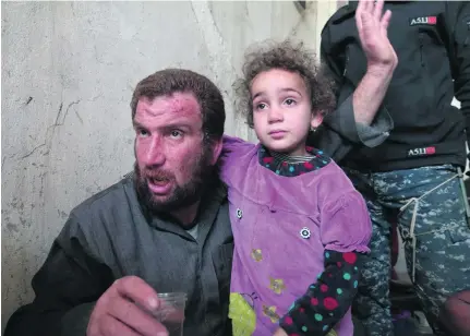  ?? Florian Neuhof for The National ?? Rayan Jasser and his daughter Ayesha escaped Mosul’s Old City with the rest of their family.