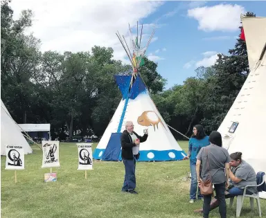  ?? CP ?? Protesters are camping in about a dozen teepees erected across from the Saskatchew­an legislatur­e in Regina.