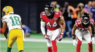  ?? CURTIS COMPTON / CCOMPTON@AJC.COM ?? Vic Beasley (44, lining up with Robert Alford) was injured early in the third quarter and did not return Sunday night in the Falcons’ 34-23 victory over the Packers.