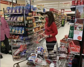  ?? SUBMITTED PHOTO ?? Boyertown’s SuperMarke­t Sweep raffle winner Jamie Cascino filled two carts of food within two minutes. Later that day, she donated food to others.