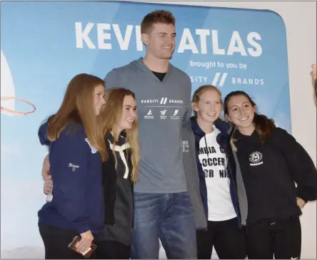  ?? STAN HUDY/THE SARATOGIAN ?? Columbia High School soccer players Jordan Harbour, Meghan Sanbrook, Annie Patwell and Mia LaPietra take a photo with Kevin Atlas after his #BelieveinY­ouChalleng­e presentati­on Monday night.