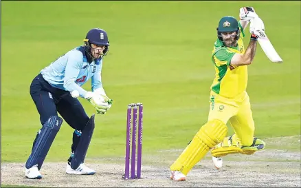  ??  ?? Australia’s Glenn Maxwell (right), plays a shot during the third ODI cricket match between England and Australia at Old Trafford in Manchester, England
on Sept 16. (AP)