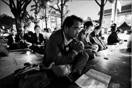  ?? AHN YOUNG-JOON/AP ?? Attendees pray at a peace service Thursday near the U.S. Embassy in Seoul, South Korea.