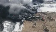  ?? GLENN THIBEAULT/The Canadian Press ?? Smoke rises from a CN Rail derailment
near Gogama, Ont., Sunday.