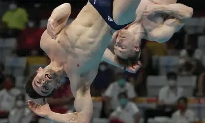  ??  ?? Great Britain’s Daniel Goodfellow and Jack Laugher of Britain fall short during the men’s synchronis­ed 3m springboar­d final. Photograph: Dmitri Lovetsky/AP