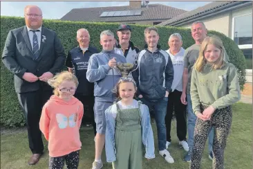  ?? ?? Back row, from left: Vice president Gordon Graham, Kenny Kerr snr, Stephen Gorman, Kevin Stone, Kenny Kerr jnr, JD McCallum and John McLatchie. Front: the three young ladies who presented the trophy, Christina McMillan, Aimee McIlroy and Grace McMillan, great-granddaugh­ters of Edith McFadyen.