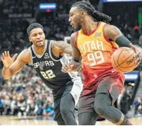 ?? Darren Abate / Associated Press ?? Rudy Gay, guarding Utah’s Jae Crowder, scored 23 points one week after scoring zero in the Spurs’ blowout loss at the Jazz.