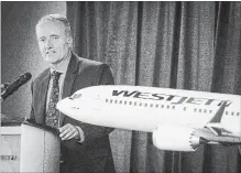  ?? JEFF MCINTOSH THE CANADIAN PRESS ?? Soaring fuel costs, labour unrest, and steep competitio­n caused WestJet Airlines Ltd. to incur its first loss in 13 years during the second quarter.