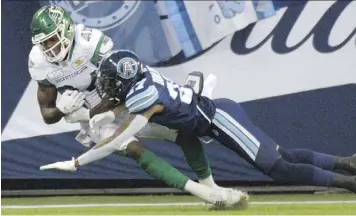  ?? JON BLACKER/THE CANADIAN PRESS ?? The Roughrider­s’ Jordan Williams-Lambert scores on a touchdown catch against the Argos Saturday.