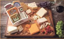  ?? WISCONSIN CHEESE MART ?? Wisconsin Cheese Mart’s Wine Connoisseu­r Collection Gift Crate includes five award-winning Wisconsin cheeses that pair well with wine.