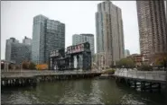  ?? BEBETO MATTHEWS — THE ASSOCIATED PRESS ?? A former dock facility is shown with old transfer bridges, with “Long Island” painted in large letters at Gantry State Park in the Long Island City section of Queens, N.Y.