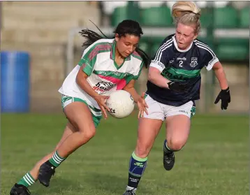  ??  ?? Evelyn Deans from Baltinglas­s looks to go past Bray’s Lauren Rowe. Photo: Joe Byrne