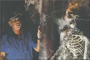  ?? The Sentinel-Record/Tanner Newton ?? HORRIFIC MOOD: Bill Volland, owner of the Central Theater, shows part of the theater’s decoration­s for the eighth annual Hot Springs Internatio­nal Horror Film Festival that begins Thursday.