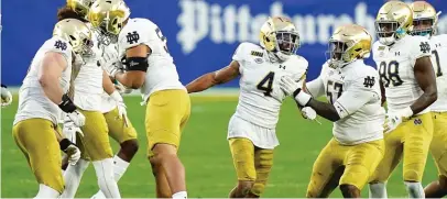  ?? JUSTIN BERL/ GETTY IMAGES ?? Nick McCloud ( 4) and the rest of the Notre Dame defense have had plenty to celebrate this season.