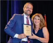  ?? LOANED PHOTO ?? FELECIA ROTELLINI (RIGHT), PRESIDENT of the Arizona Democratic Party, honors Luis Heredia as an inductee in the state party’s hall of fame.