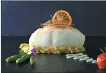  ??  ?? Steamed codfish with leek, lemon sauce and asparagus is a signature dish on the new menu offered by Via Roma.