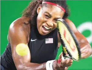  ?? ROBERTO SCHMIDT/AFP ?? USA’s Serena Williams plays a shot in her match with France’s Alize Cornet in the second round at the Rio 2016 Olympic Games on August 8.