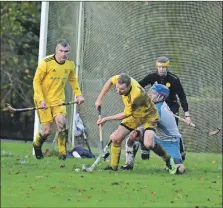  ?? Photograph­s: Andrew Sinclair. ?? Action from Saturday’s game between Inveraray and Skye Camanachd at the Winteron. The 0-0 draw meant Skye secured the Mowi National Division title.