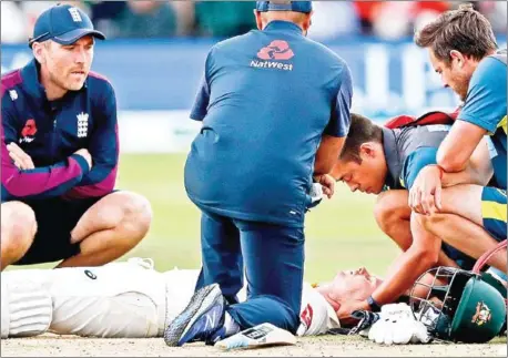  ?? ADRIAN DENNIS/AFP ?? Australia’s Steve Smith lays on the pitch after being hit on the head off the bowling of England’s Jofra Archer during the fourth day of the second Ashes cricket Test match at Lord’s Cricket Ground in London on Saturday.