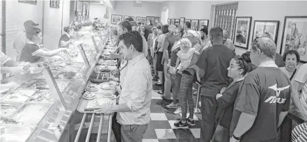  ?? Karen Warren photos / Houston Chronicle ?? Cleburne Cafeteria officially opens to the public Thursday, but lines were already long at the eatery’s soft opening on Tuesday.