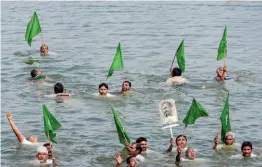  ?? — PTI ?? Farmers from Amaravathi stage Jala Deeksha protest against a three-project proposal at Rayapudi village in Guntur district , Tuesday.