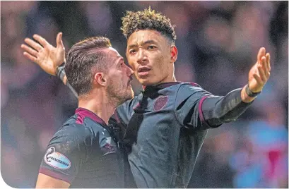  ??  ?? Hearts’ Sean Clare, right, celebrates with Donis Avdijaj after scoring late on to make it 3-3