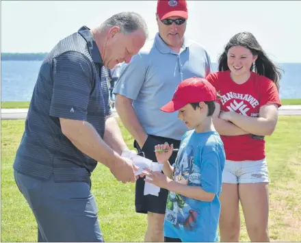  ?? DESIREE ANSTEY/ JOURNAL PIONEER ?? David Gallant gets an autograph from Head coach of the Vegas Golden Knights, Gerard “Turk” Gallant.