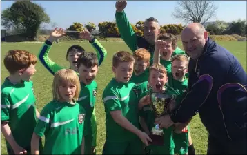  ??  ?? Joint captains Lucas Fitzpatric­k and Charlie Murray accepting the trophy from Don Hearne.