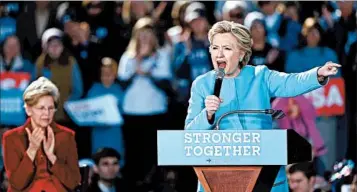  ?? CJ GUNTHER/EPA ?? Hillary Clinton, joined by Massachuse­tts Sen. Elizabeth Warren, left, speaks Monday at a New Hampshire campaign event.