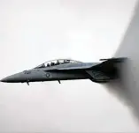  ?? TY GREENLEES / STAFF FILE PHOTO ?? An F/A-18F Super Hornet throws a vapor cloud during a rehearsal flight for a past Vectren Dayton Air Show.