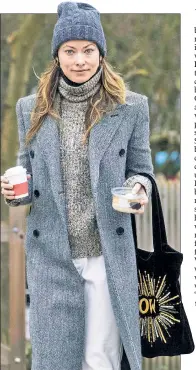  ??  ?? Olivia Wilde — who has been posting behind-thescenes pics from her film “Don’t Worry Darling,” which she directed — grabs a coffee and a snack in London.