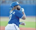  ?? ADRIAN KRAUS — THE ASSOCIATED PRESS ?? The Blue Jays’ Vladimir Guerrero Jr. gestures to the crowd as he rounds the bases after hitting a three-run home run against the Marlins.