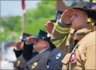  ?? MARIAN DENNIS – DIGITAL FIRST MEDIA ?? Firefighte­rs gave a salute as Pottstown career firefighte­r Michael Sedlock Jr. was taken to his final resting place in St. Aloysius Cemetery.