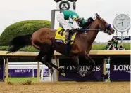  ?? Dylan Buell/Getty Images ?? Jockey Flavien Prat rides Flightline to win the Longines Breeders’ Cup Classic by 8¼ lengths.