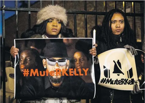  ?? — THE ASSOCIATED PRESS ?? #MuteRKelly supporters protest outside R. Kelly’s studio in Chicago on Wednesday. The TV series Surviving R. Kelly has sparked a public backlash against the singer who denies any wrongdoing.